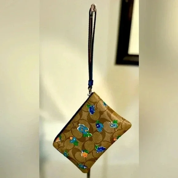 Gently Used COACH F57588 Zip Wristlet in Floral Print Coated Canvas - Picture 2 of 4